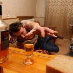 A man reaches for a glass